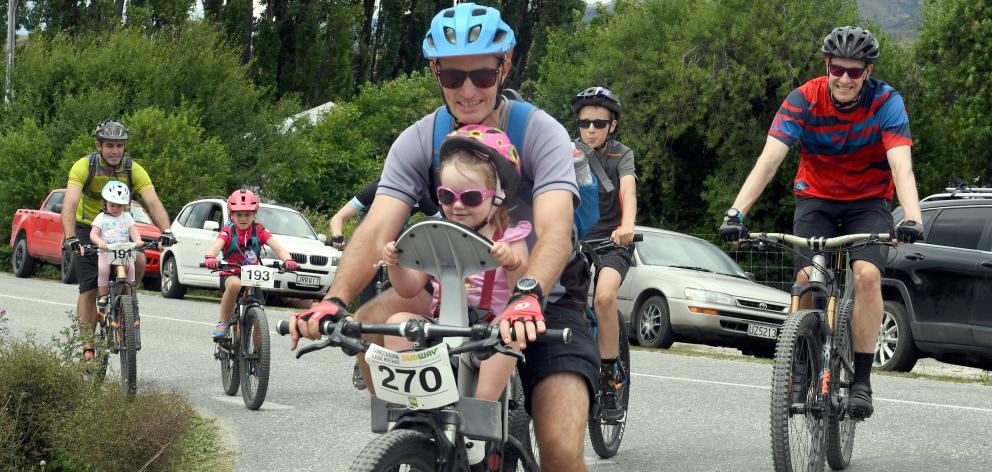 Pippa Julian (6) and father Scott, of Arrowtown, near the start of the Bannockburn Classic yesterday. Photo: Stephen Jaquiery