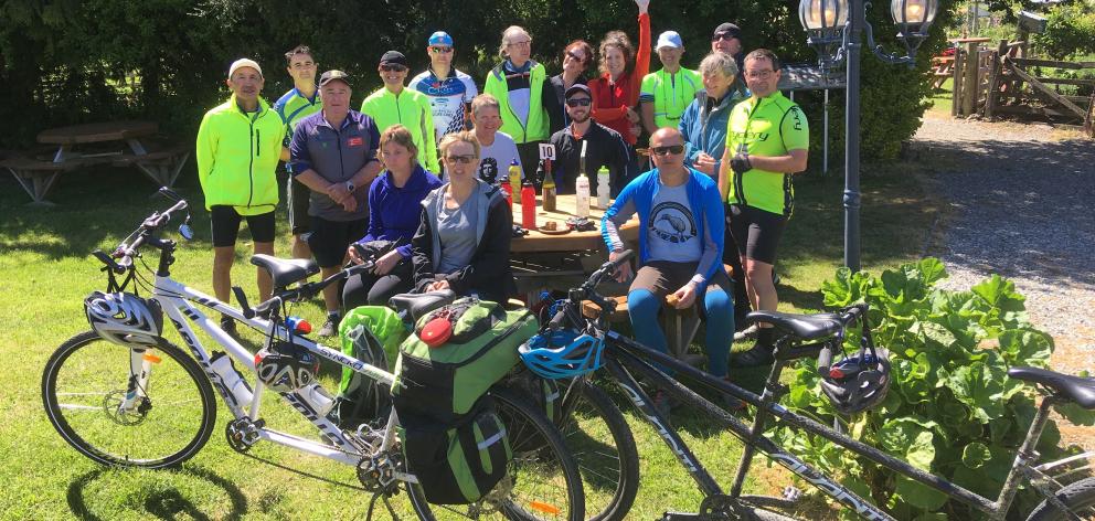 Participants in the Blind Foundation’s national tandem bike event take a break after reaching Chatto Creek during their Otago Central Rail Trail ride. Photo: Alexia Johnston