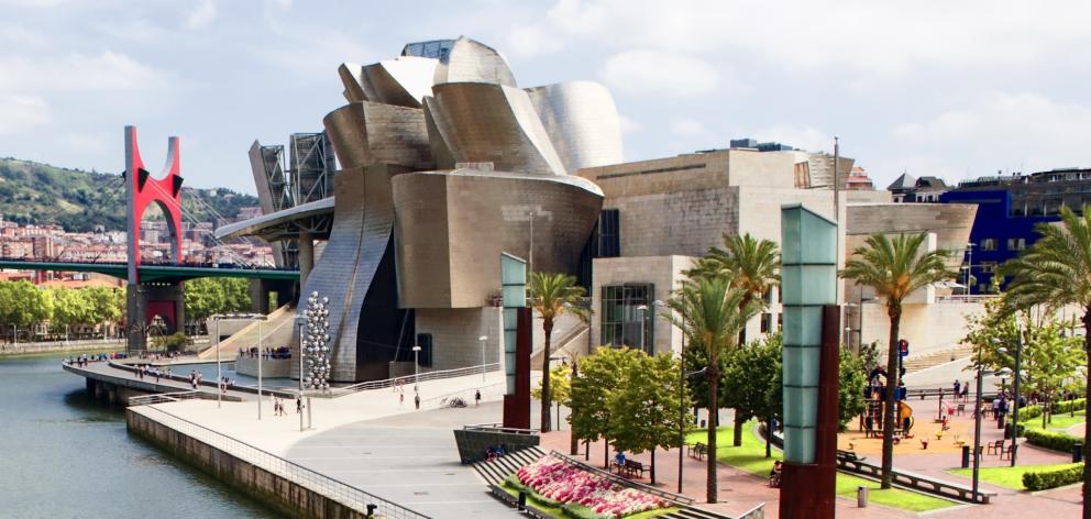 The Guggenheim Museum in Bilbao, Spain attracts worldwide attention, draws tourists and has...