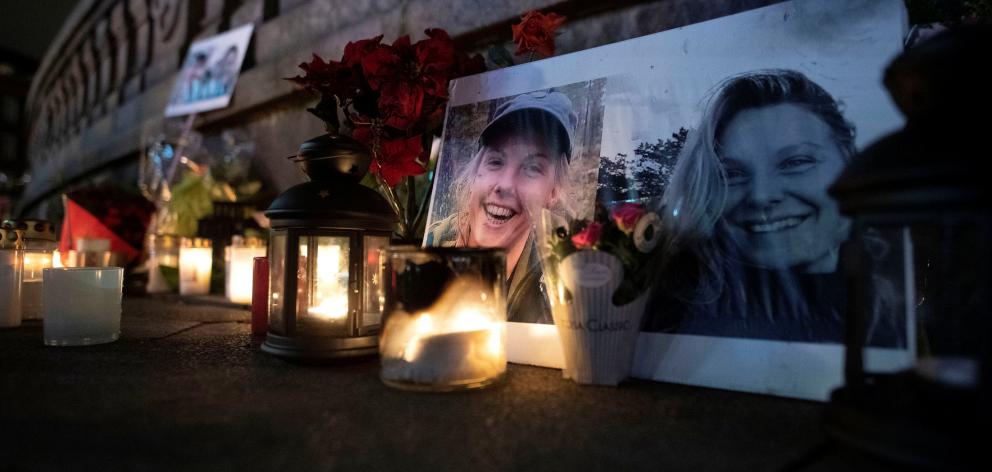 Flowers and candles in memory of Louisa Vesterager Jespersen and Maren Ueland are seen at the Town Hall Square in Copenhagen. Photo: Ritzau Scanpix via Reuters