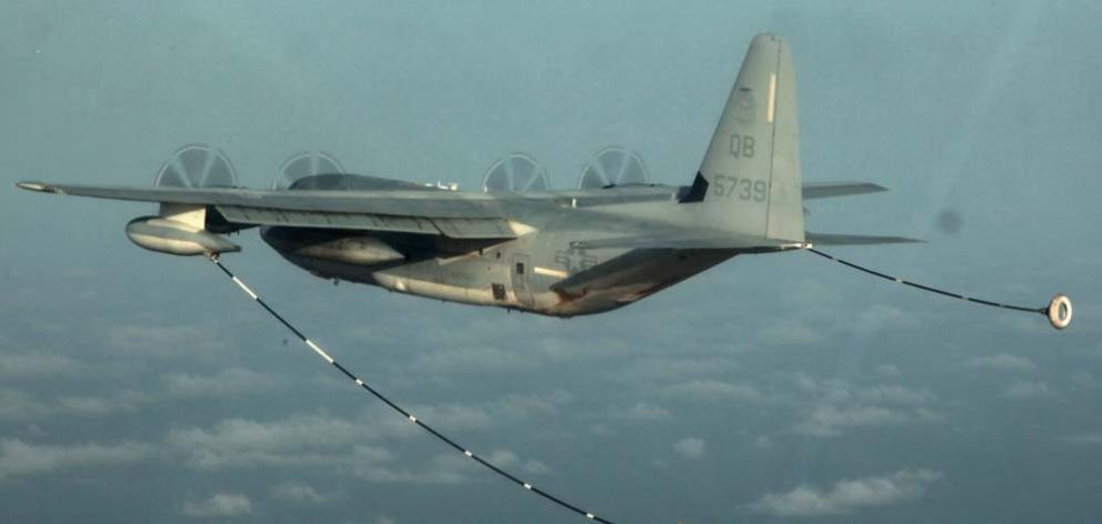 A KC-130 Hercules conducting air refuelling training over the Pacific Ocean. Photo: US Marine Corps photo by Cpl. John Robbart III via Reuters