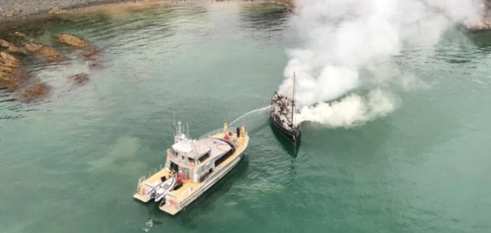 A boat caught fire near Waiheke Island. Photo: Auckland Rescue Helicopter Trust