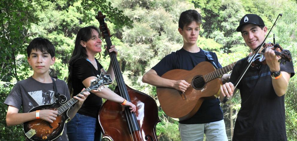 Getting ready to delight the crowds at the Whare Flat Folk Festival are Ngaruawahia family bluegrass band RhodeWorks, featuring (from left) Nate Frangos-Rhodes (12, mandolin), Tracy Frangos (double-bass), Laurence Frangos-Rhodes (17, guitar) and Sam Frang