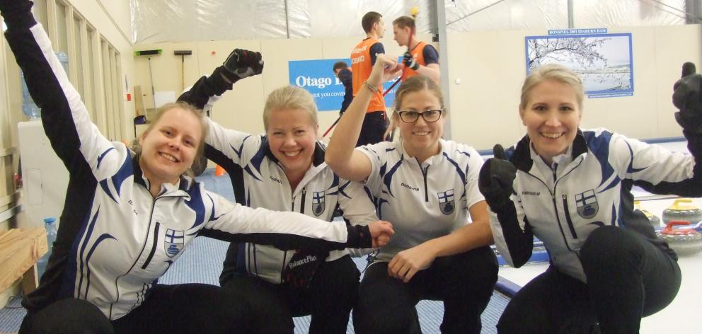 The Finnish women's curling team of (from left) Lotta Immonen, Maija Salmiovirta, Eszter Juhasz and Oona Kauste, following their 8-1 win over Hungary yesterday. Photo: Adam Burns