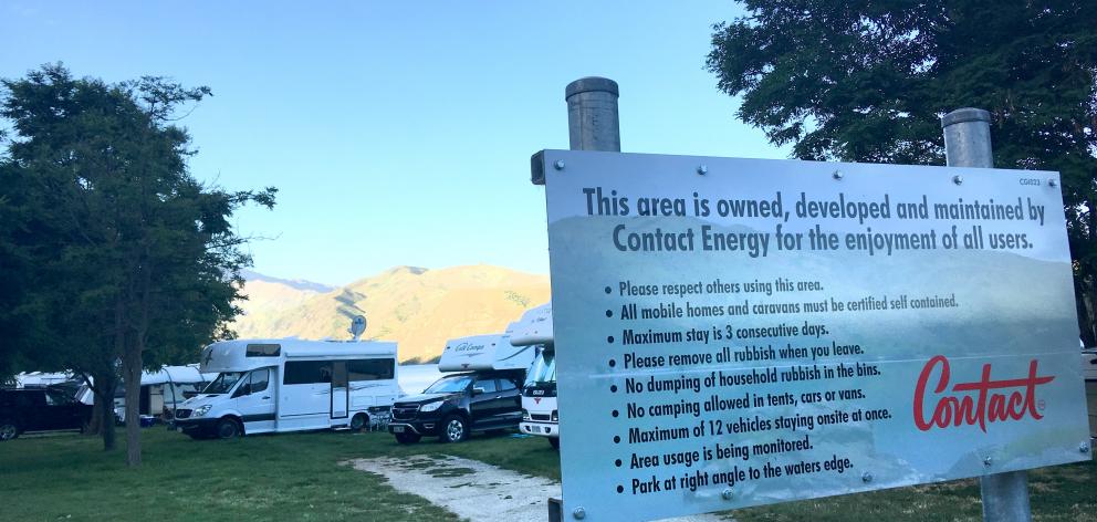 A line-up of camping vehicles begins near a sign outlining the rules of the Burton Creek camping area, near the Dunstan Arm Rowing Club. Photos: Pam Jones