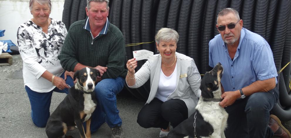 Rose Davidson (second from right), of Alzheimers South Canterbury, holds a cheque for money raised by local dog triallists. With her are (from left) Ali and Chris Calder and Kevin Ashworth. Photo: Chris Tobin