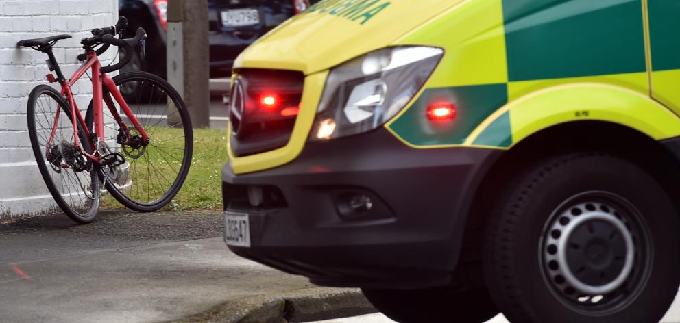 Ambulance and police at an accident between a vehicle and cyclist on corner of Hanover St and...