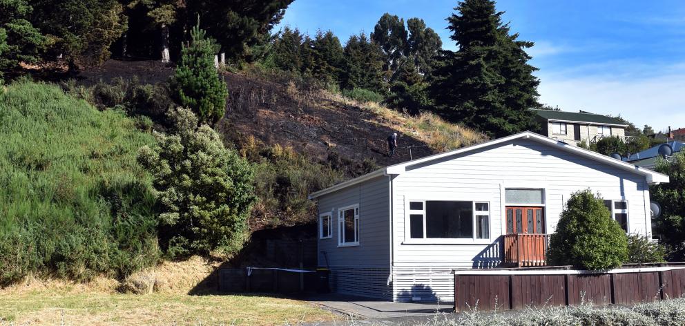 A vegetation fire in Kaikorai Valley Rd early yesterday came perilously close to at least one...