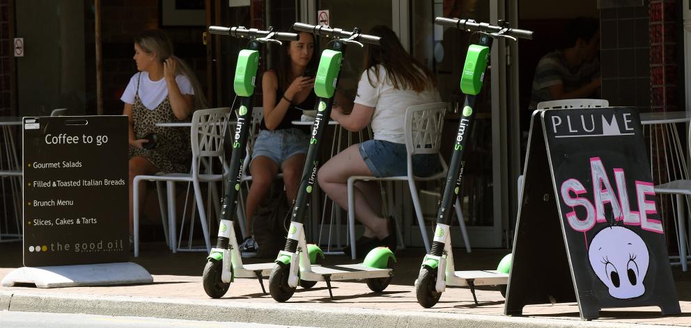 Lime scooters are parked on the footpath in George St, Dunedin. Photo: Stephen Jaquiery