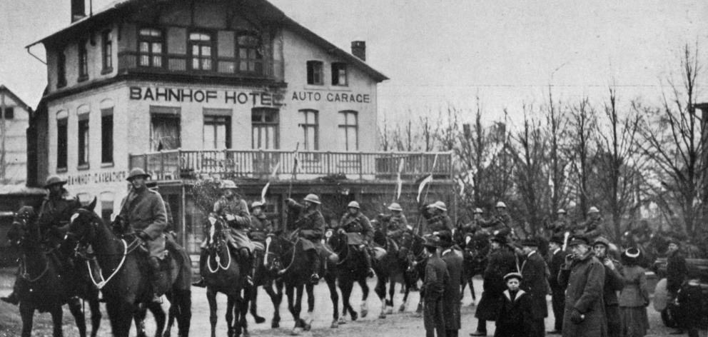The first entry into a German town after the armistice: British lancers entering Malmedy. — Otago Witness, 26.2.1919.