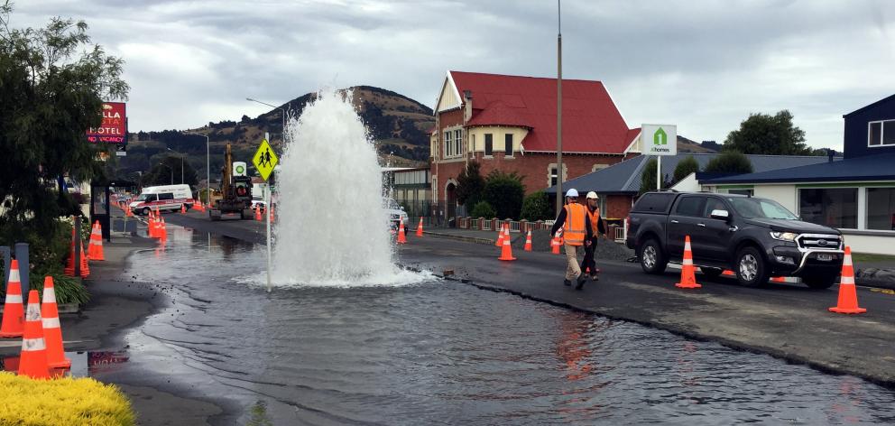 A temporary water fountain gushes from a damaged fire hydrant in Gordon Rd on Tuesday. Photo: Suze Watts, Downer A temporary water fountain gushes from a damaged fire hydrant in Gordon Rd on Tuesday. Photo: Suze Watts, Downer