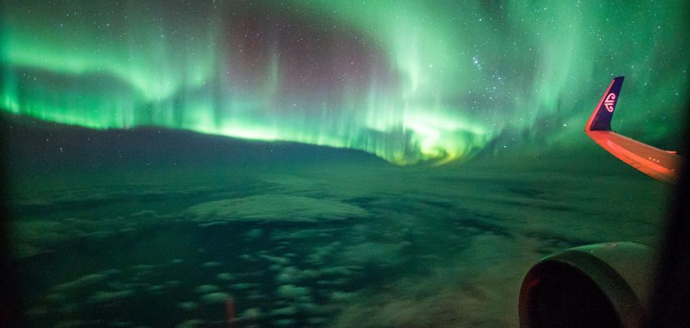 The aurora australis viewed from "Flight to the Lights'', in March 2017. PHOTO: BRAD PHIPPS