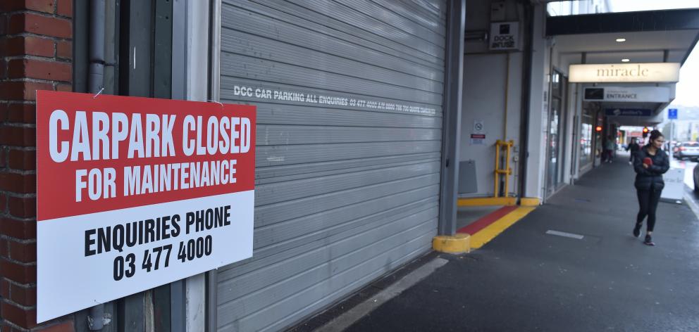 A sign on the closed door of the Wall Street Mall car park in St Andrew St conveys the bad news...