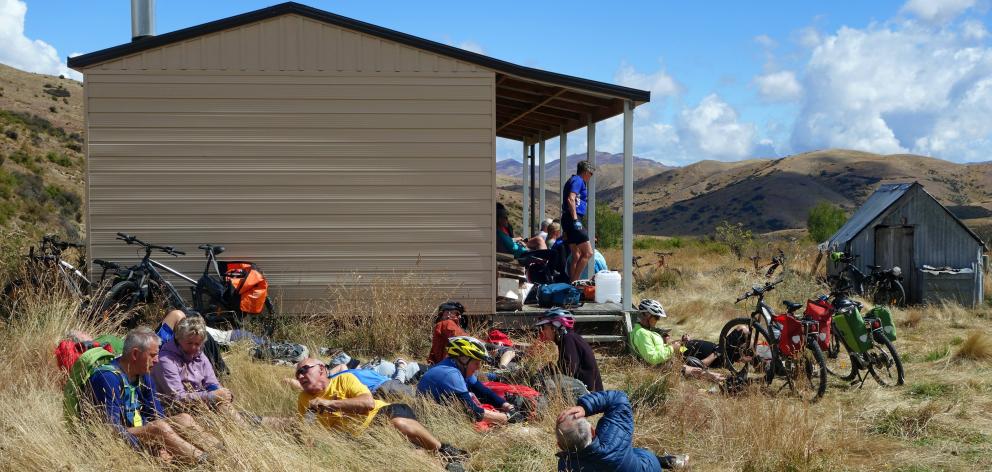 Push Bike Trail riders enjoy lunch at a Merivale Station hut on day 1.