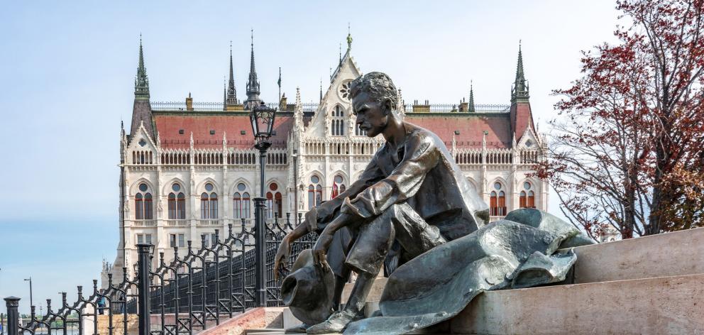 A bronze statue of Hungarian poet Jozsef Attila on the banks of the Danube River.
