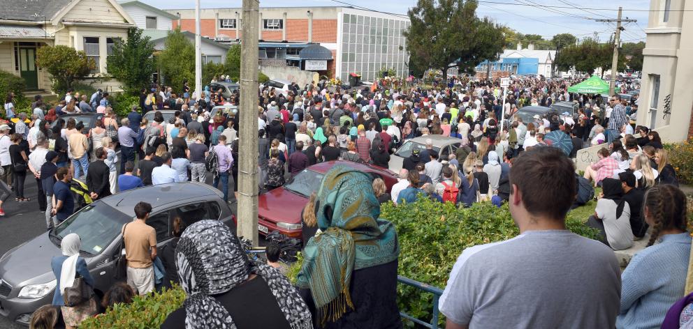 About 1000 people gather outside the Al Huda mosque yesterday. PHOTO: STEPHEN JAQUIERY