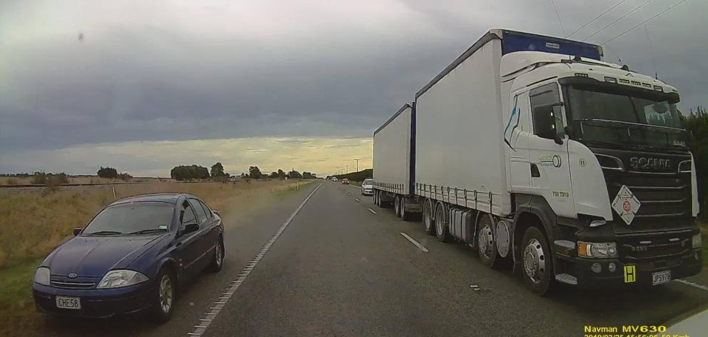 A still taken from footage of a driver coming inches away from colliding with oncoming traffic during a dangerous overtaking manoeuvre south of Christchurch. Photo: Stephen Carter