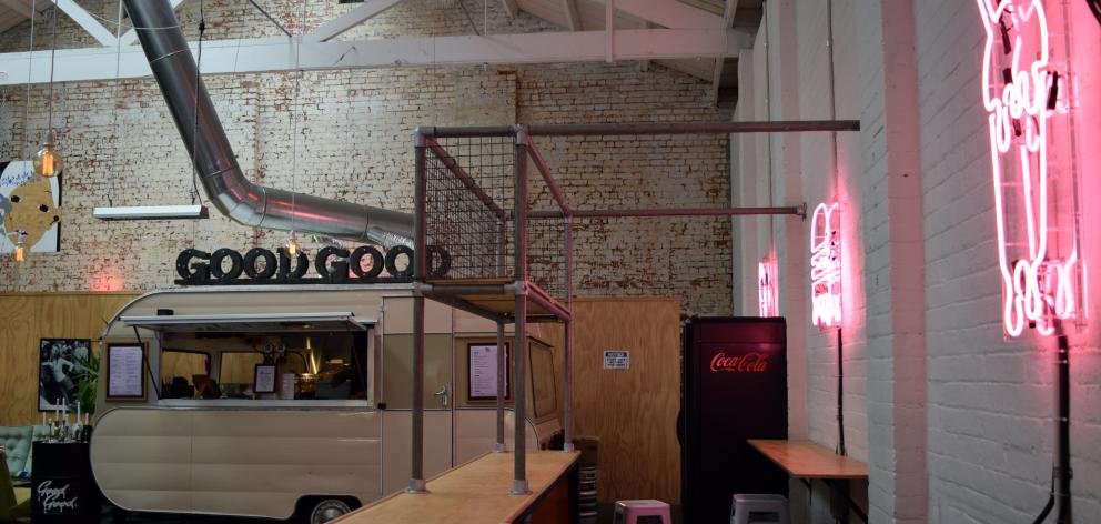 A counter is being built to move the beer taps and point-of-sale out of the cara­van used as a kitchen inside Dunedin eatery Good Good in Vogel St. Photo: Shawn McAvinue