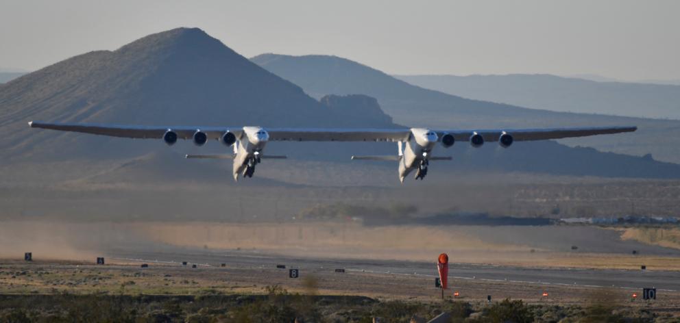 The world's largest airplane, built by the late Paul Allen's company Stratolaunch, makes its...