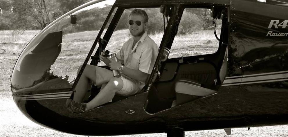 Mitch Gameren at the controls of a helicopter during a stint working in Botswana.