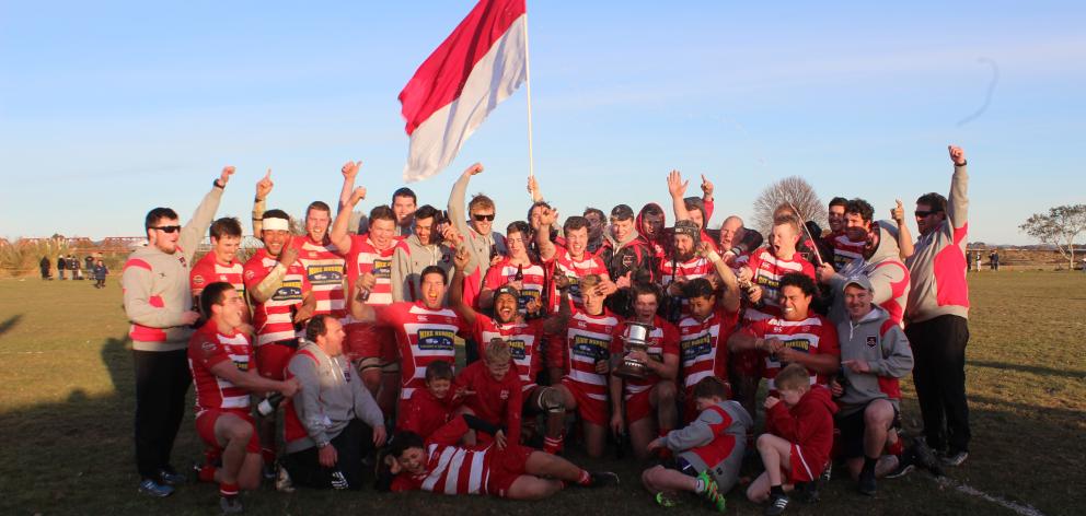 The Clutha Rugby team celebrates its 60-12 win against Crescent in the Southern Region final on...