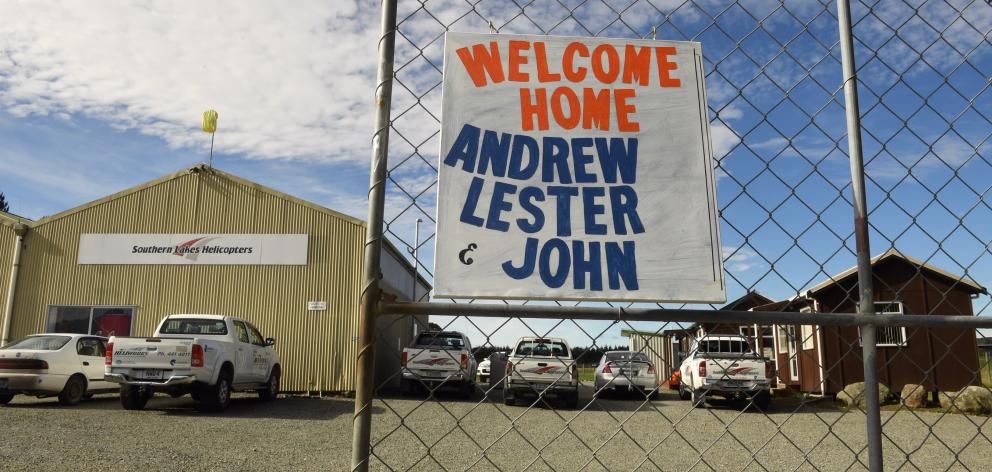 A "welcome home" sign at Southern Lakes Helicopters for the trio who were involved in a helicopter crash in the Southern Ocean yesterday. Photo: Stephen Jaquiery