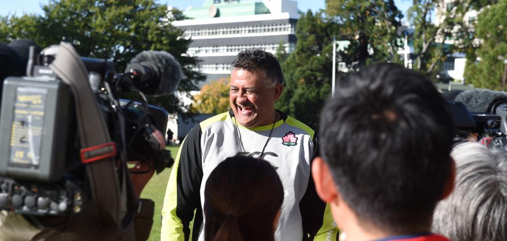 Japan coach Jamie Joseph laughs during a press conference at the North Ground yesterday. Photo:...