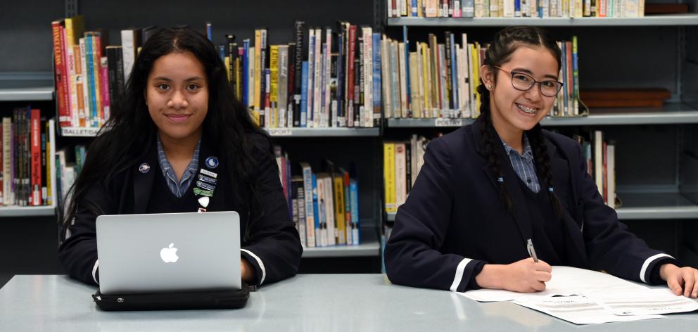 Otago Girls' High School pupils Moli Ahokovi (17, left) and Sofia Fortunato (19) show their preference for sitting NCEA exams. Photo: Gregor Richardson