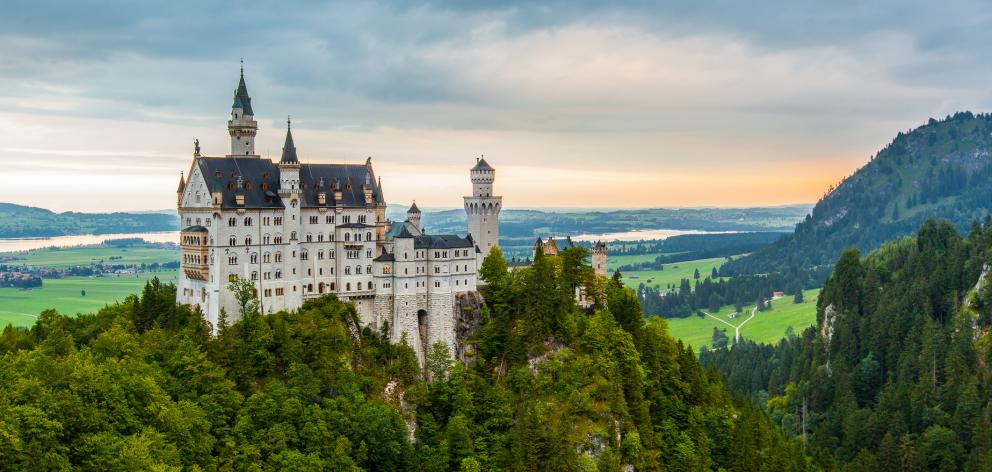 Sunset at Neuschwanstein Castle from Marienbrucke, Germany. Photo: Getty Images