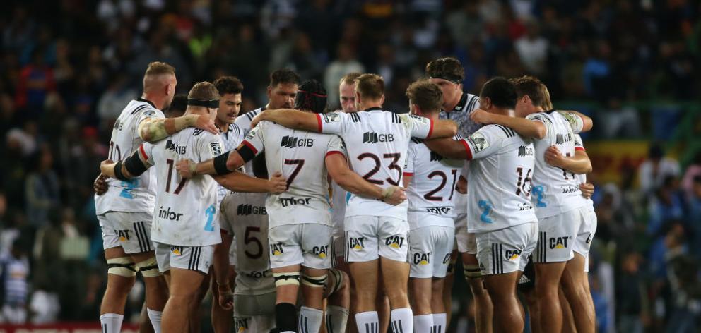 Crusaders huddle as the TMO checks a possible forward pass during the Super Rugby match between DHL Stormers and Crusaders. Photo: Getty Images