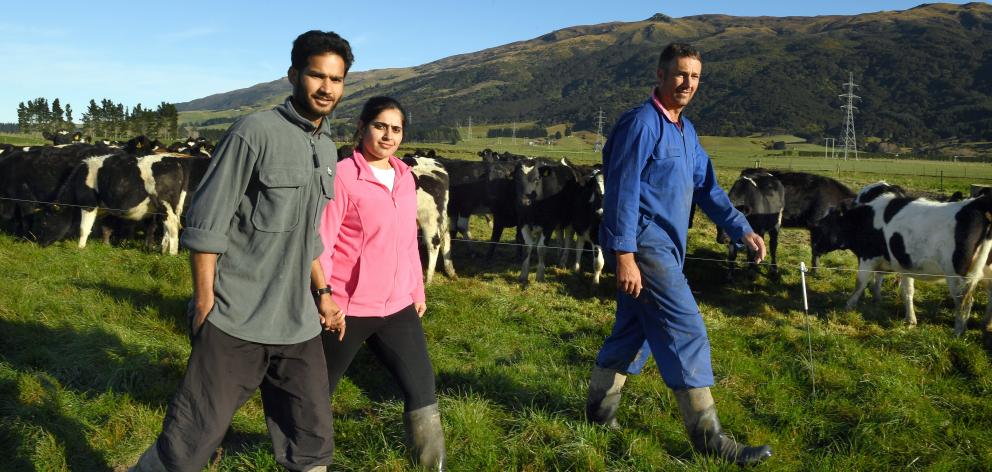Harrie and Pawan Chander are able to stay in New Zealand where Mr Chander works for Woodside...