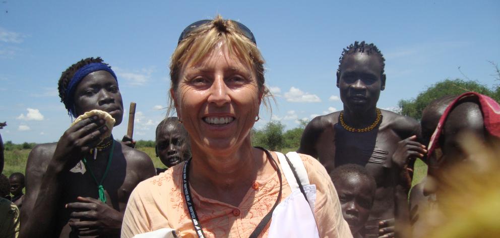Felicity Gapes, pictured with some of the people she helped in the Jongili area of South Sudan. Her work in the country included developing a first aid programme for South Sudan Red Cross. Photo: Supplied