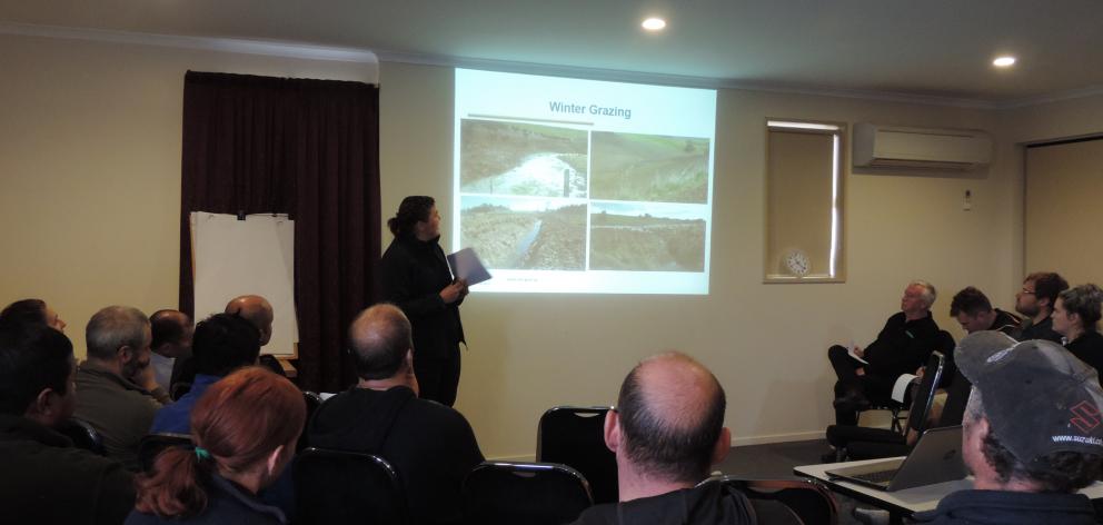 Otago Regional Council rural liaison and support officer Nicole Foote shows photographs of winter grazing causing unacceptable runoff. Photo: Sally Brooker