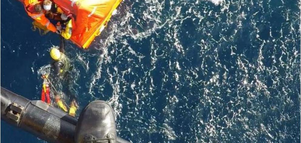 The moment four stricken crew members were winched to safety from a drifting life raft in the...