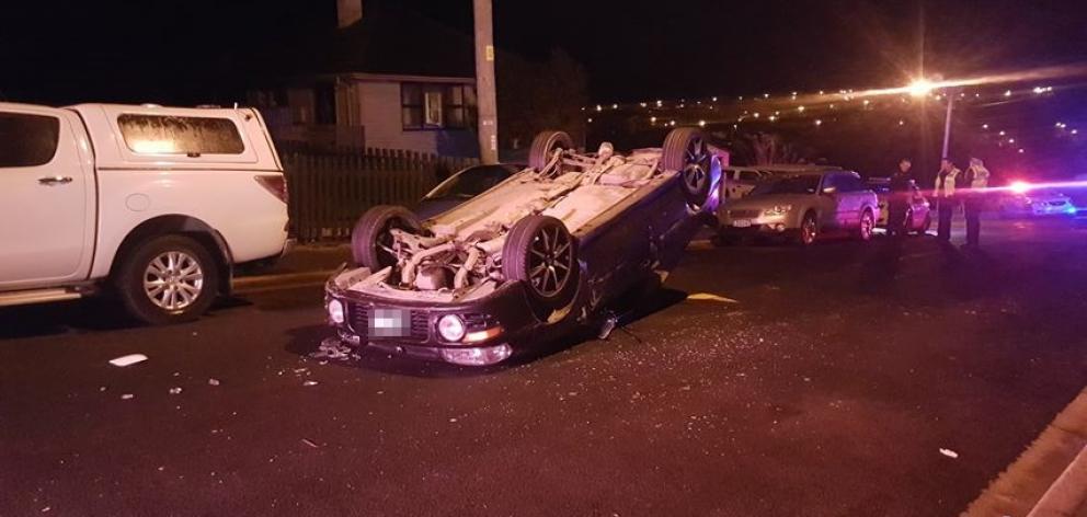 A car rolled after hitting two parked cars in Calton Hill early this morning. Photo: Kris Campbell