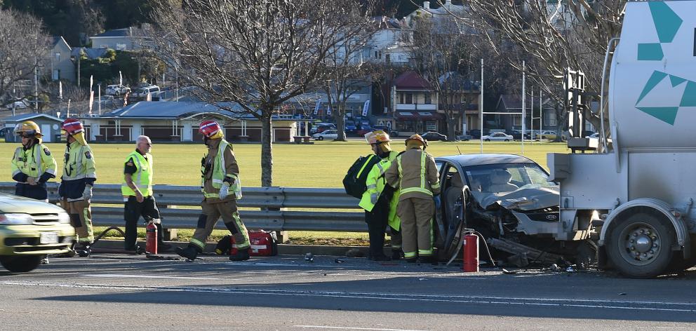 Emergency services attend a car versus truck accident at the Oval today. Photo: Gregor Richardson