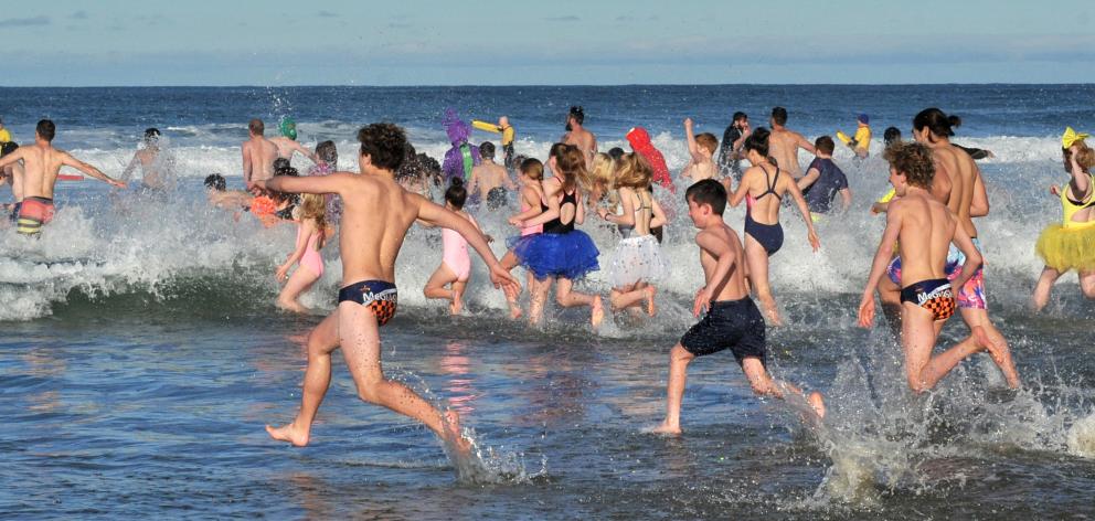 Swimmers brave a "refreshing" dip. Photos: Christine O'Connor 