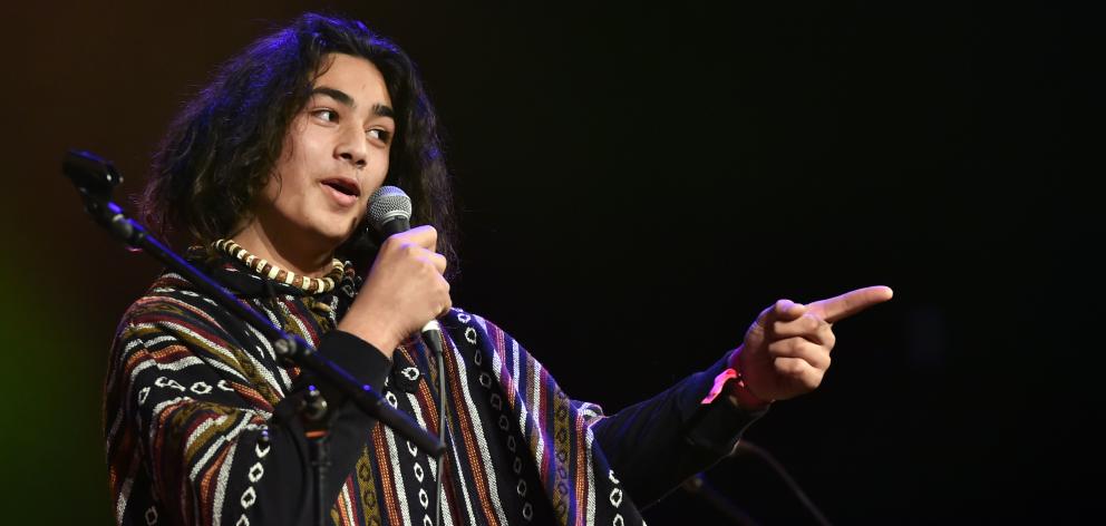 Te Kahurangi McLean (15) sets a moody tone as the frontman of Kings’ High School’s M.C.S.  at the...