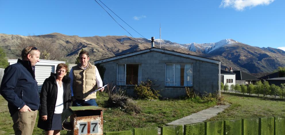 Wanaka Primary School principal Wendy Bamford meets board member Mitch Campbell (right) and chairman Andrew Howard at the Roche St teacher residence to be demolished and replaced with two four-bedroom homes. Photo: Kerrie Waterworth