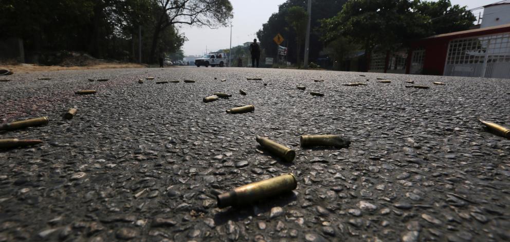 Bullet casings lie on the street near a crime scene in Acapulco. Photo: Reuters