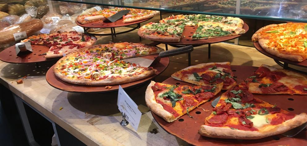 Pizza by the slice is ready for the taking at the Wholefoods Market, on South Grand Avenue. Photo: Pam Jones