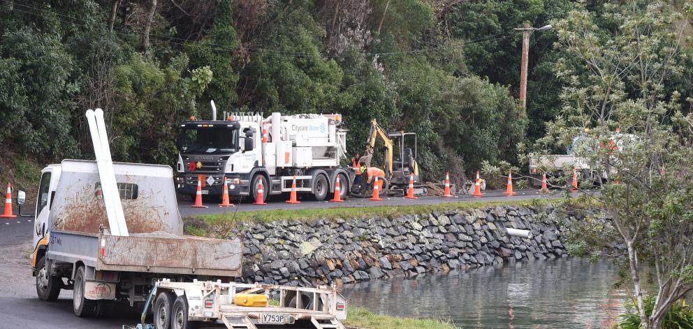 Contractors fix a water leak in Careys Bay on Saturday. PHOTO: GREGOR RICHARDSON