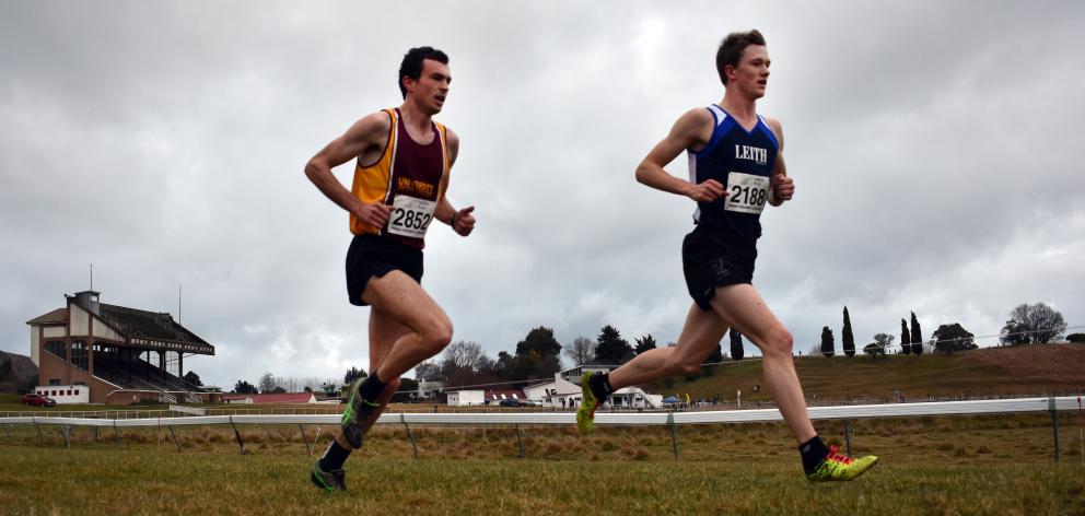 Daniel Balchin (left) and Janus Staufenberg battle it out over the back end of the Otago cross...