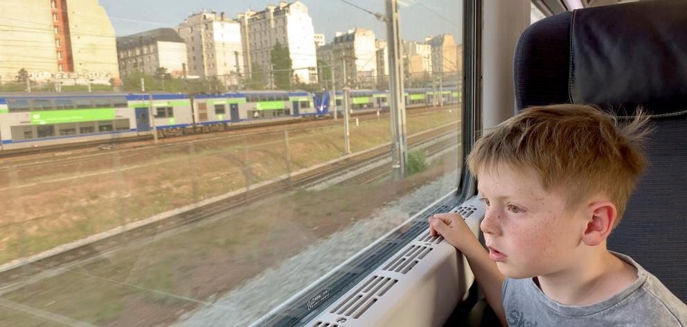 The Eurostar hurtles into Paris just two hours after it left London, captivating Hugo in the process. Photos: Craig Borley