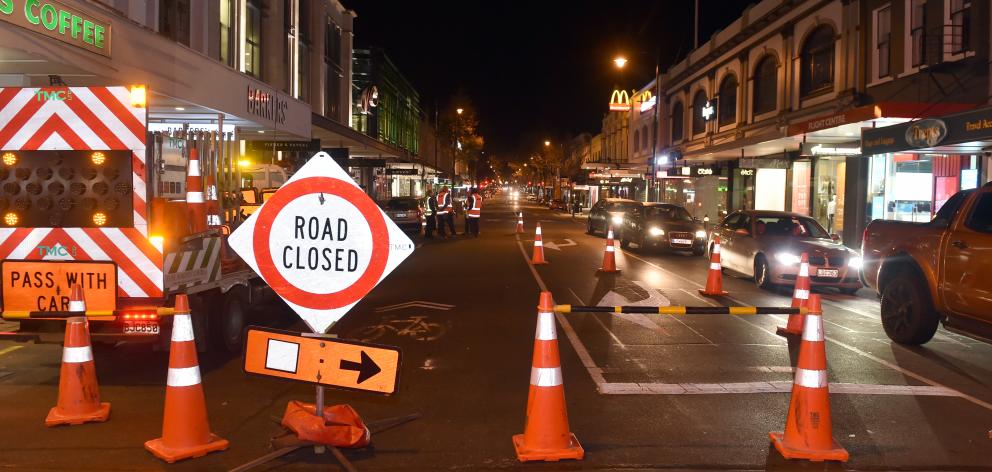 Workers start to close part of George St northbound yesterday. Photo: Peter McIntosh