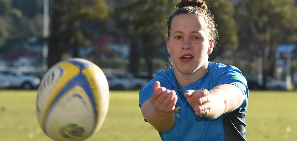University flanker Georgia Mason shows her passing style at Logan Park earlier this week.PHOTO:...