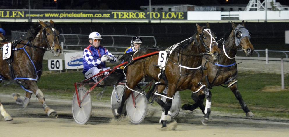 Gimmefiveminutesmore holds off The Night Hawk (inner) and Four Starzzz Shiraz to win the Forbury...