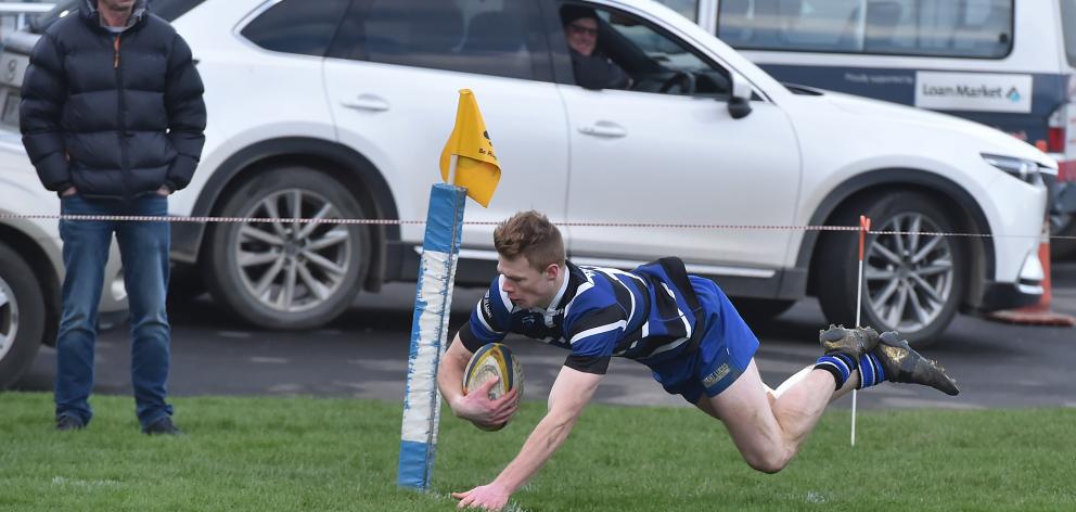 Kaikorai fullback Ben Miller scores in the corner against Harbour at Watson Park on Saturday....