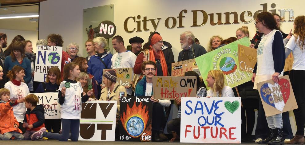 Protesters gather inside the Dunedin City Council building yesterday to support councillors who...
