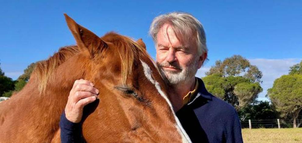 Sam Neill hanging out with his horse on his Queenstown Farm. Photo / @TwoPaddocks Twitter
